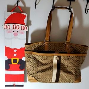 Used Coach diaper bag. Brown and beige. In great condition!